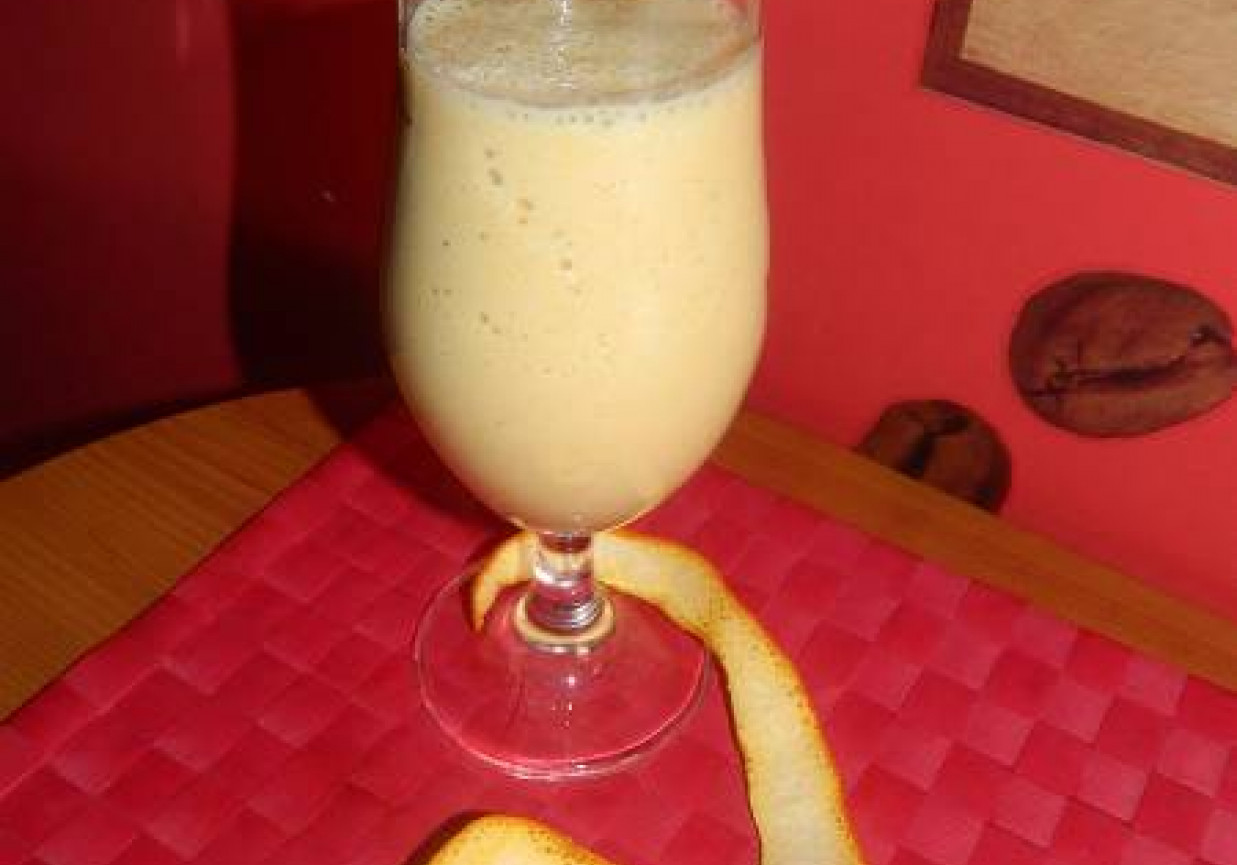 Mleczny koktajl bananowo - pomarańczowy z miodem. foto