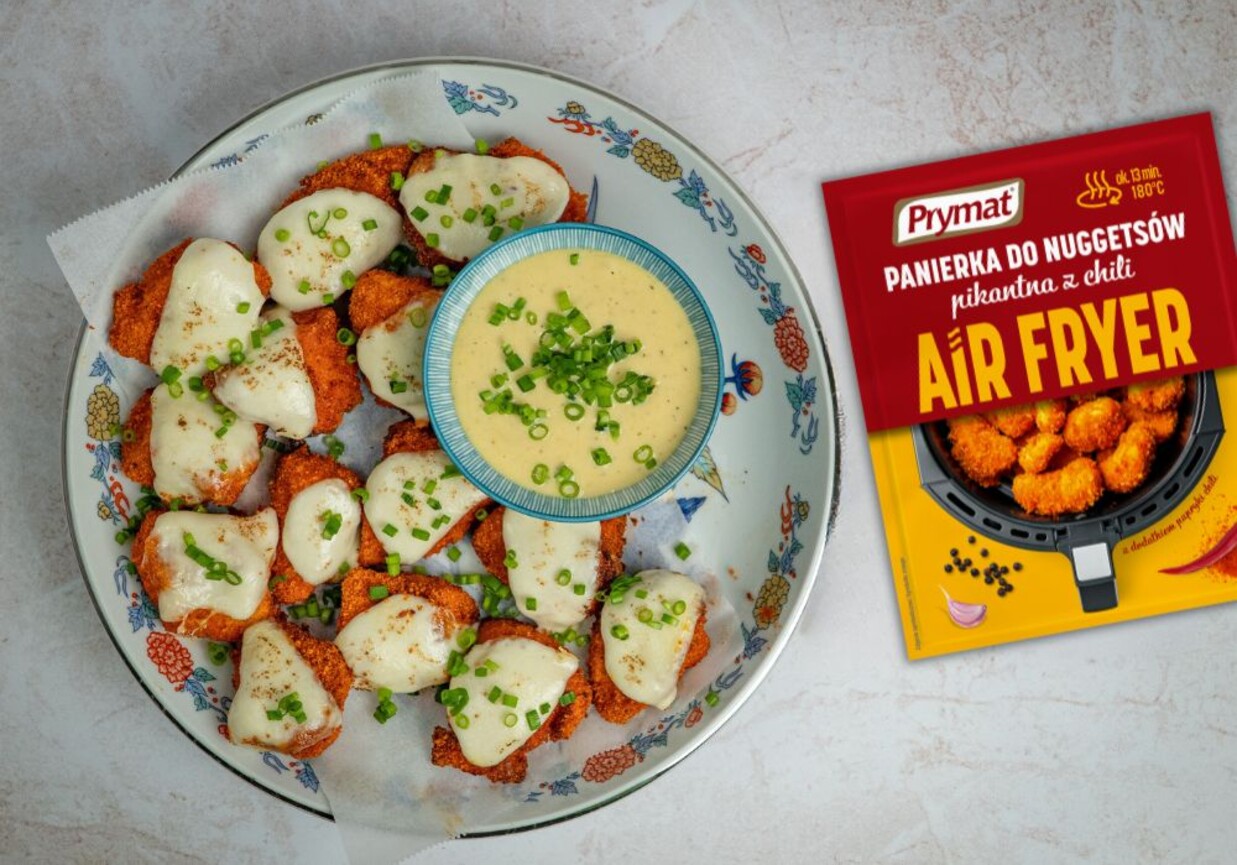 Pikantne nuggetsy z kurczaka zapieczone pod serem foto